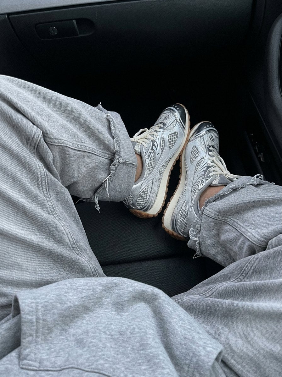 Silver PRX-01 with grey baggy jeans in the car